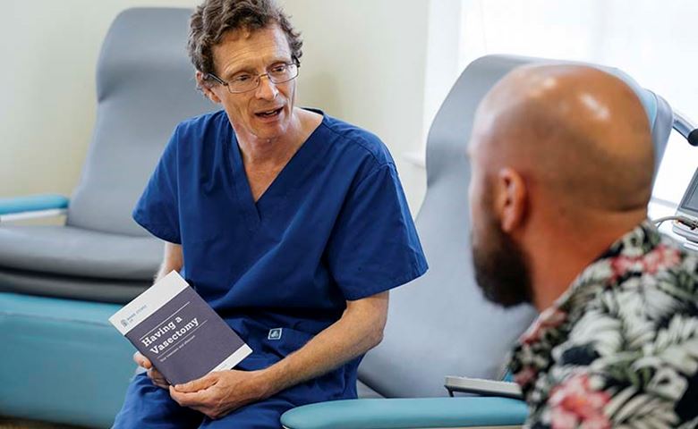 MSI UK vasectomy surgeon talking to a man inside a clinic